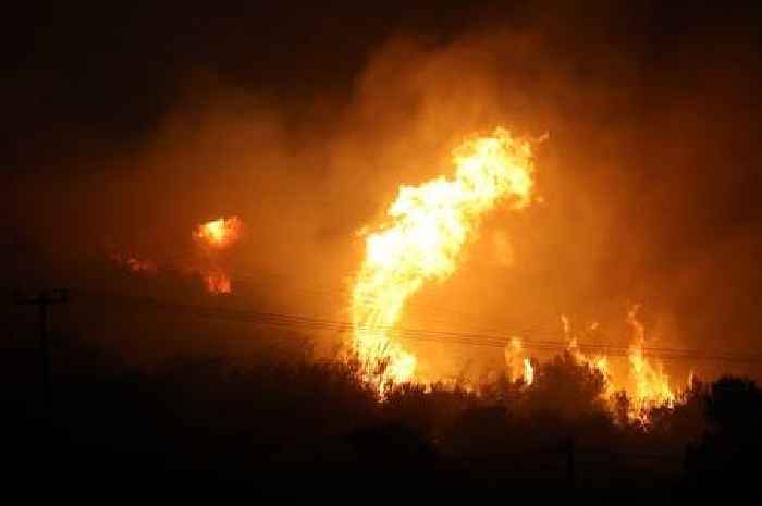 Tourists evacuated in Crete as wildfire whipped up by gale-force winds