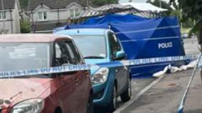 Man arrested after death of woman found injured on street