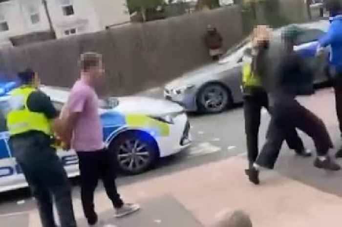 Moment man punches police officer in face as she tries to make arrest in Birmingham