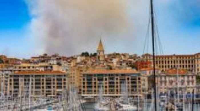 Rapidly spreading wildfire reaches edge of Marseille