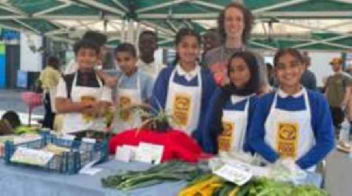 Schoolchildren sell own-grown produce at market