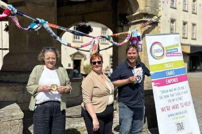 Shepton crafters yarn-bomb Market Cross for mental health cause