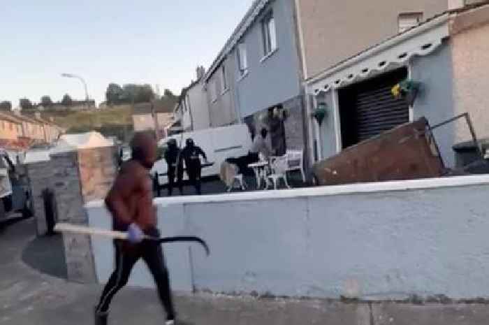 Moment armed masked gang smash up home and cars in brazen attack