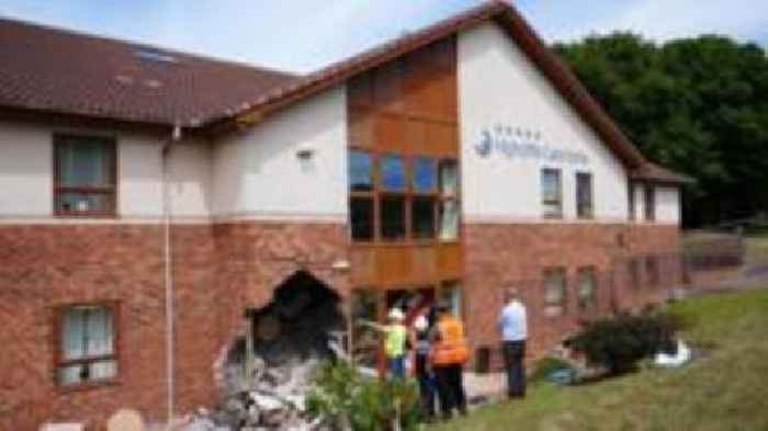 Men charged after women die following care home crash
