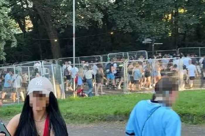 Oasis fans without tickets storm barriers of Manchester gig as police step in