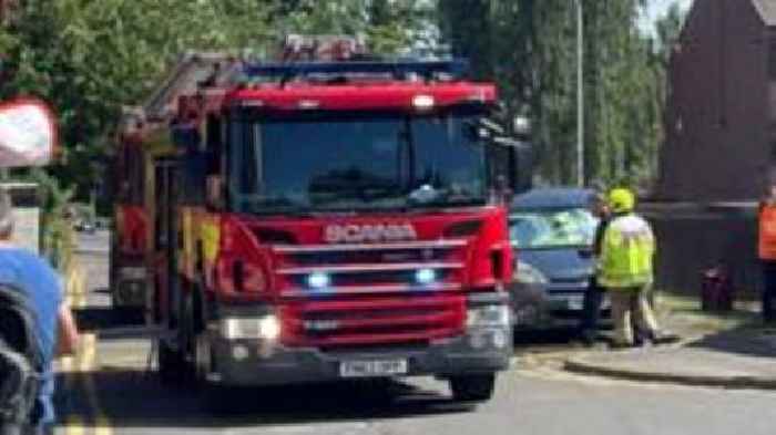 Woman taken to hospital after flat fire rescue