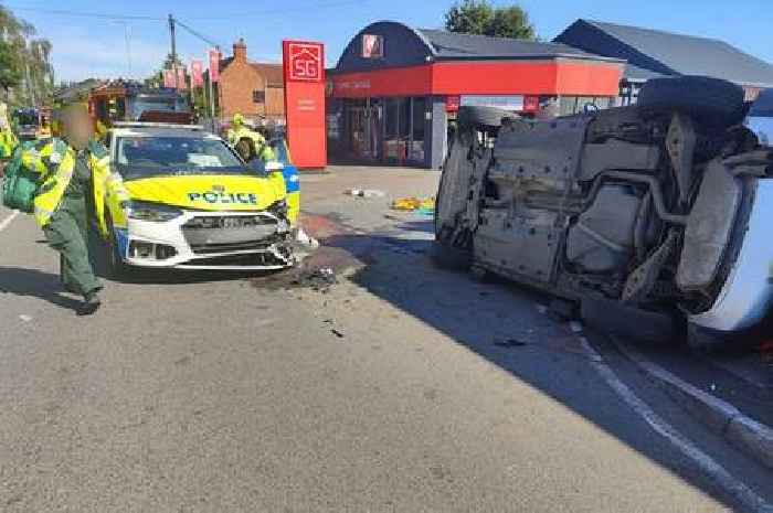 Car overturns after crash involving police car on 999 call
