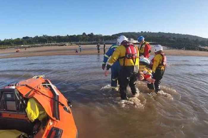People left up to their necks at Welsh beach as tide surges in