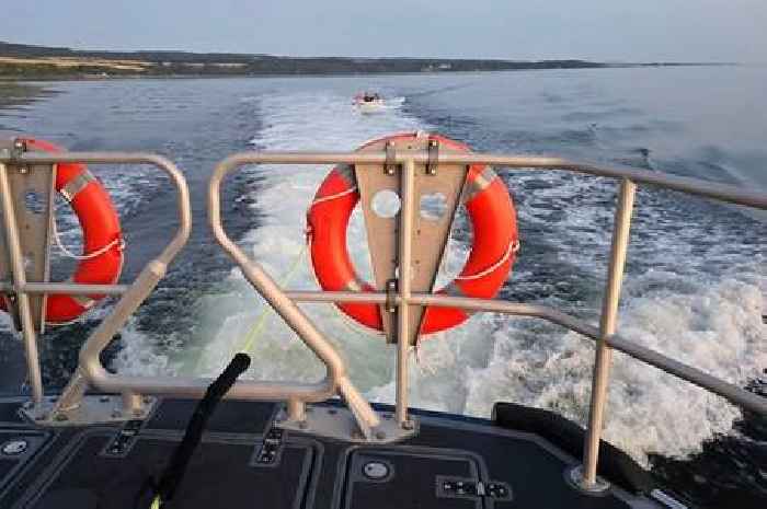 Two men and a dog help RNLI with speedboat rescue