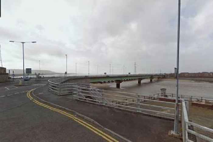 Woman dies after car hits wall outside boat club