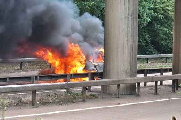 Major A-road closed as car bursts into flames