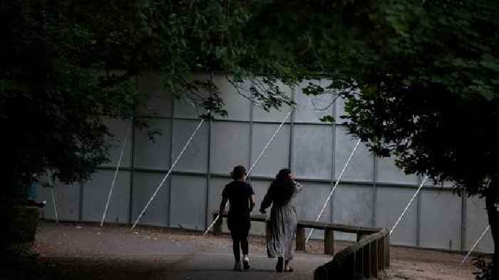 Huge steel fences erected to stop ticketless fans from watching Oasis concert