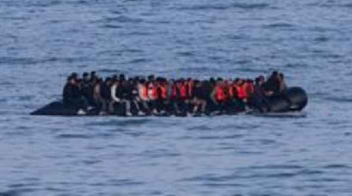Germany to tighten people-smuggling law as chancellor visits UK