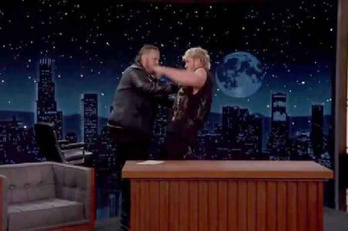 Jelly Roll chokeslams Logan Paul through table as WWE icon The Undertaker's tips pay off