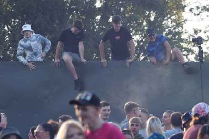 Ticketless Oasis fans ignore security as they climb fences at Manchester's Heaton Park