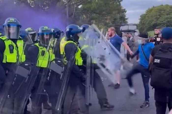 Protesters clash with police outside hotel housing asylum seekers