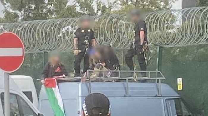 Three women charged under Terrorism Act after van driven into fence of defence factory