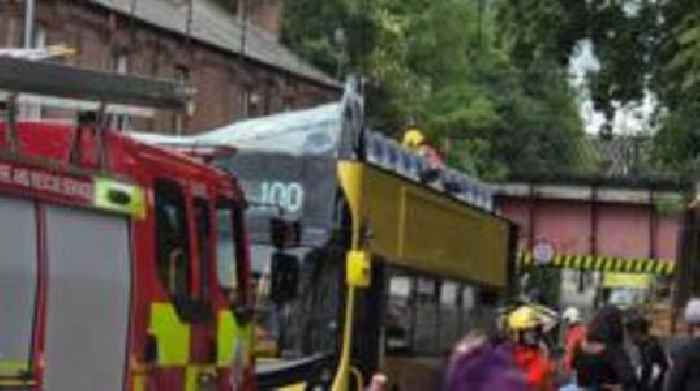 Fifteen hurt after double-decker bus hits bridge