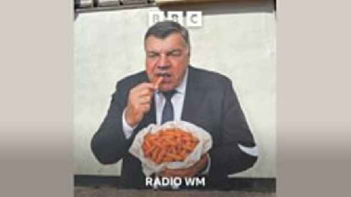 Sam Allardyce reacts to giant chip eating mural