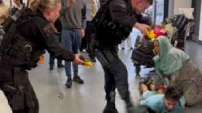 Airport brawl officer 'was a bully with a badge', jury told