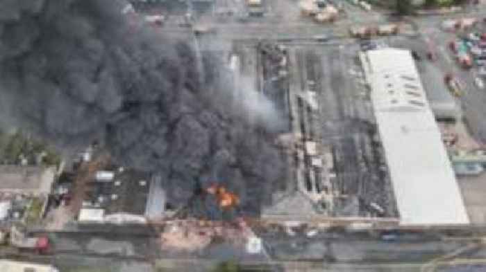 Homes evacuated as factories and tyres burn
