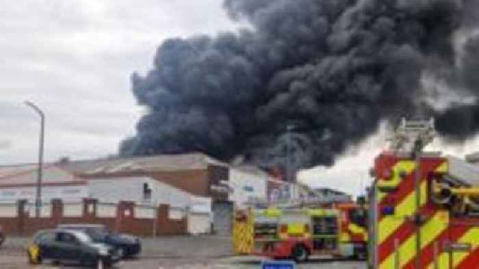 Dozens of firefighters sent to tackle factory blaze