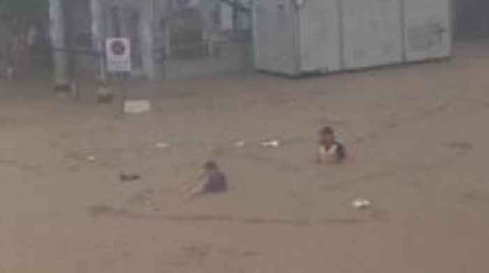 Watch: People rescued from flooded streets in China