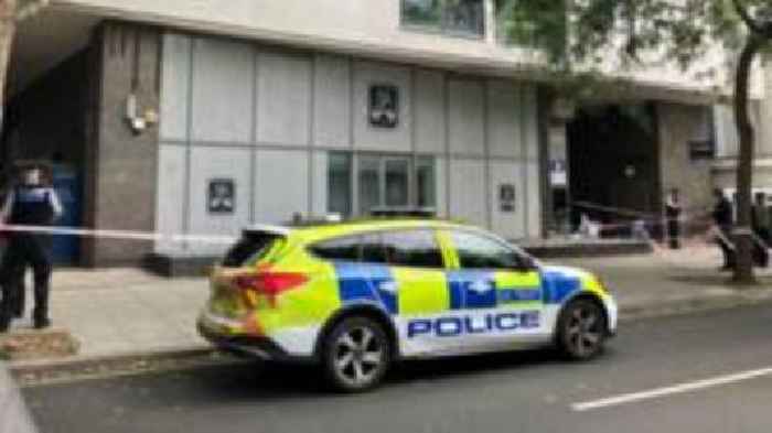 Man arrested after two killed in quadruple stabbing at business