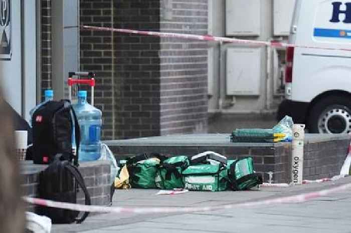 Two dead and two in hospital after four men stabbed at business