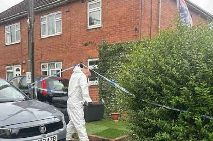Police stand guard outside taped-off Stoke-on-Trent house