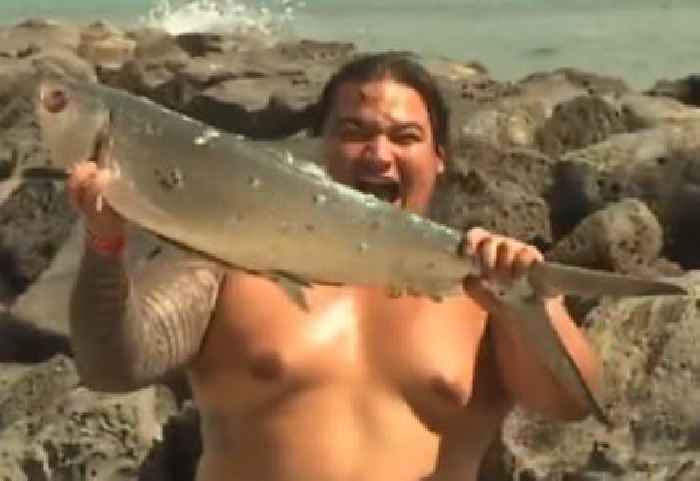 Man Uses Newscast About the Danger of Being on the Beach During a Tsunami to Show Off His Catch