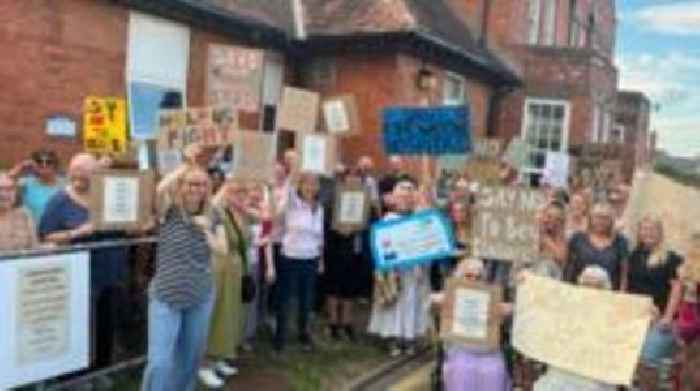 Dozens protest over plans to cut hospital beds