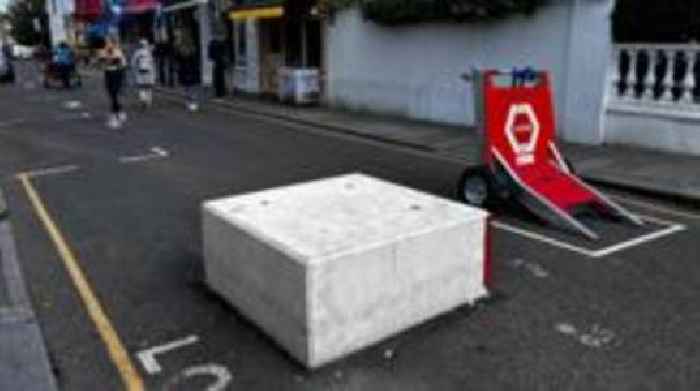 Residents take legal action over anti-terror barriers