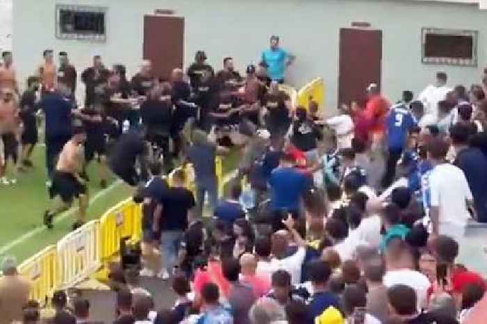 Football hooligans launch barriers at each other as police forced to stop violent clashes