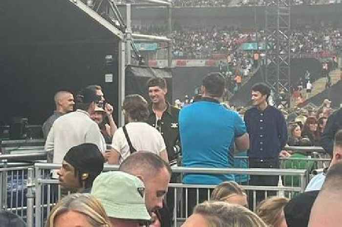 David Beckham's son Romeo spotted with rival player at Oasis concert