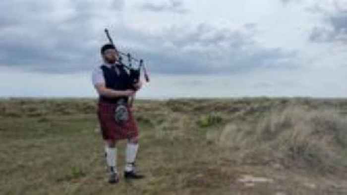 Piper plays on beach to keep the peace with neighbours
