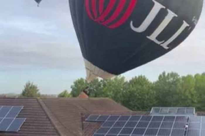 Moment balloon crashes into primary school roof during huge festival