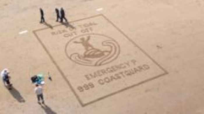 Sand art spreads summer coastal safety message