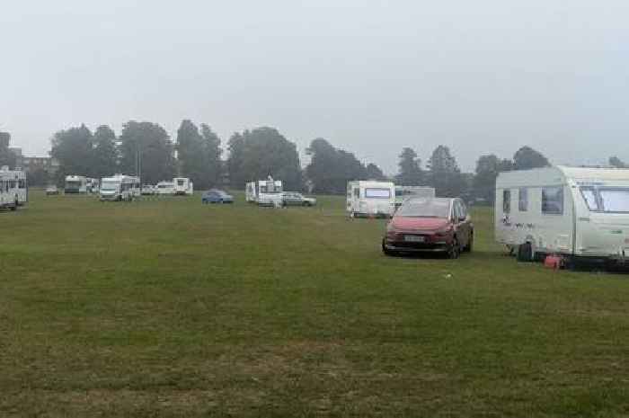 30 caravans at Surrey park as police monitor unauthorised encampment