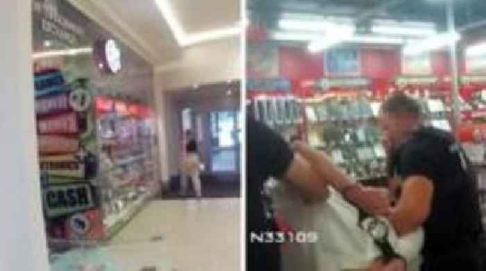 Man with hammer arrested after shop door smashed