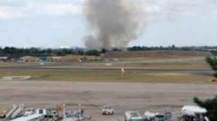 Smoke from woodland fire seen from airport