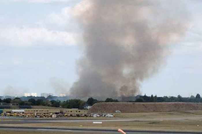 Huge plume of smoke seen from Birmingham Airport as fire crews fight woodland blaze
