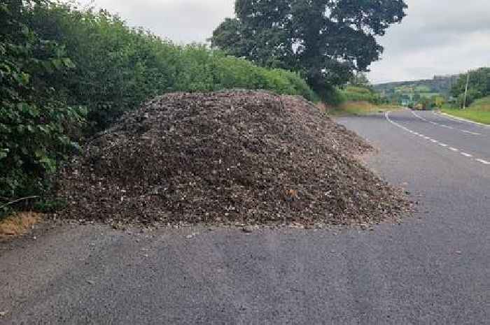 Mountain of plastic, wood and metal fly-tipped in layby