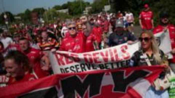 Salford fans march in protest after game cancelled