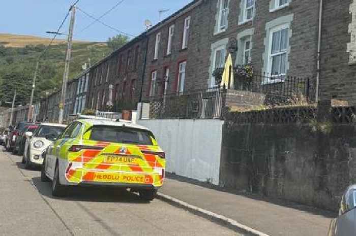 Armed police called to reports of a man with a handgun tucked into the back of his jeans