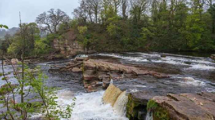 Body pulled from river in search for missing boy, 12