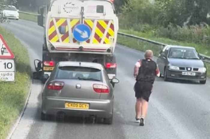 Millions watch in stitches as rugby coach jumps off team bus to save the day