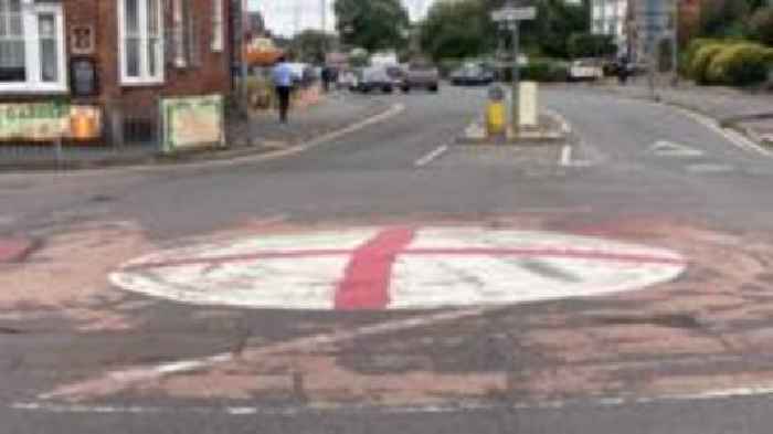 Flags to stay on lampposts but not roundabouts