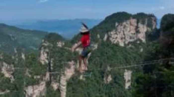 Watch: Competitors walk slackline 400m above Chinese gorge