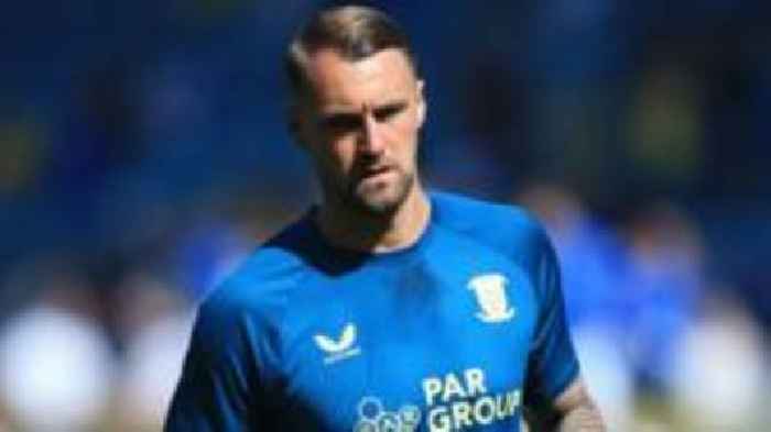 Wimbledon sign ex-Preston defender Bauer on free